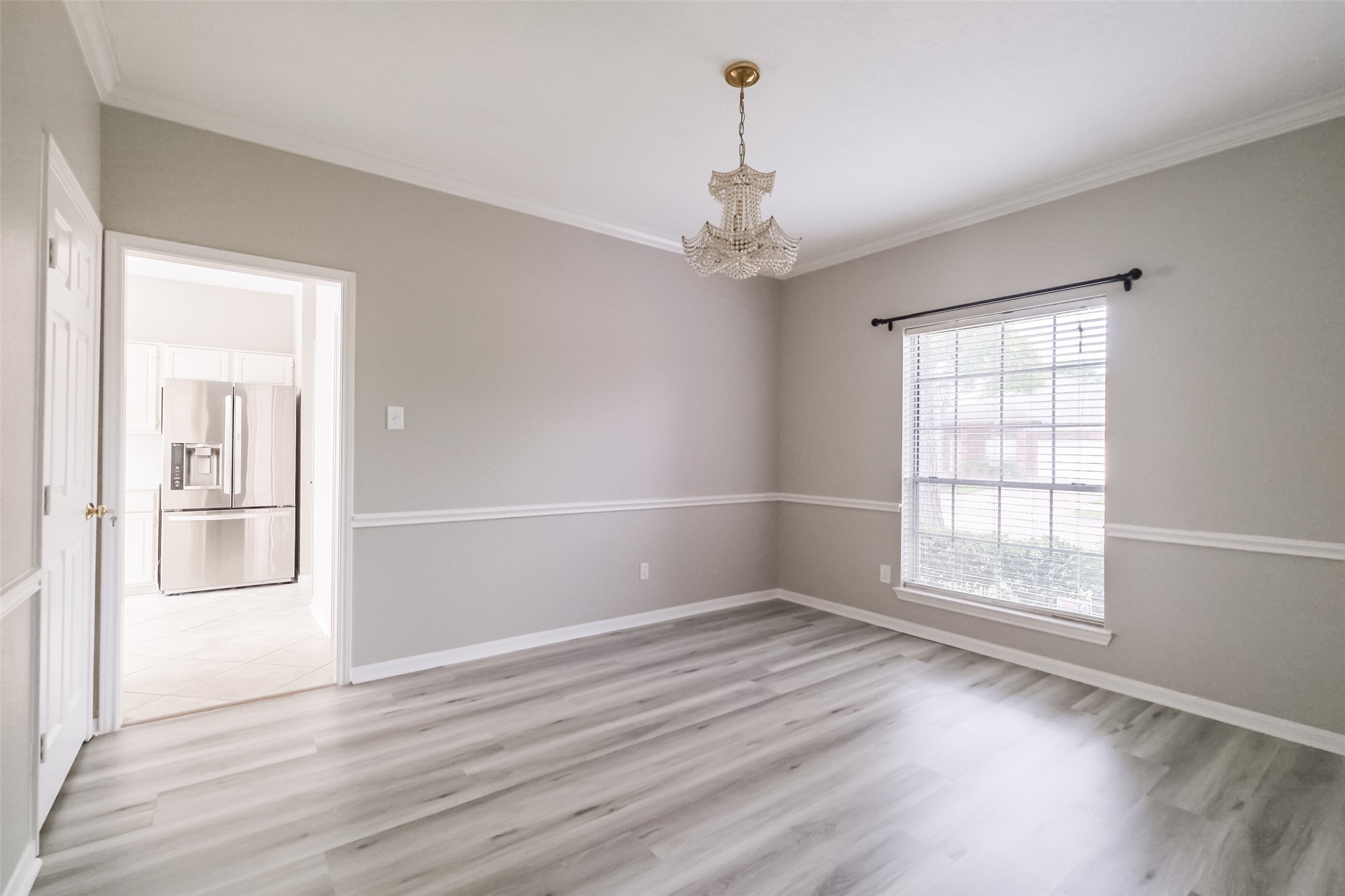 7603 Quintero Drive Houston, TX 77083 - Photo 22 of 36 an empty room with wooden floor and windows