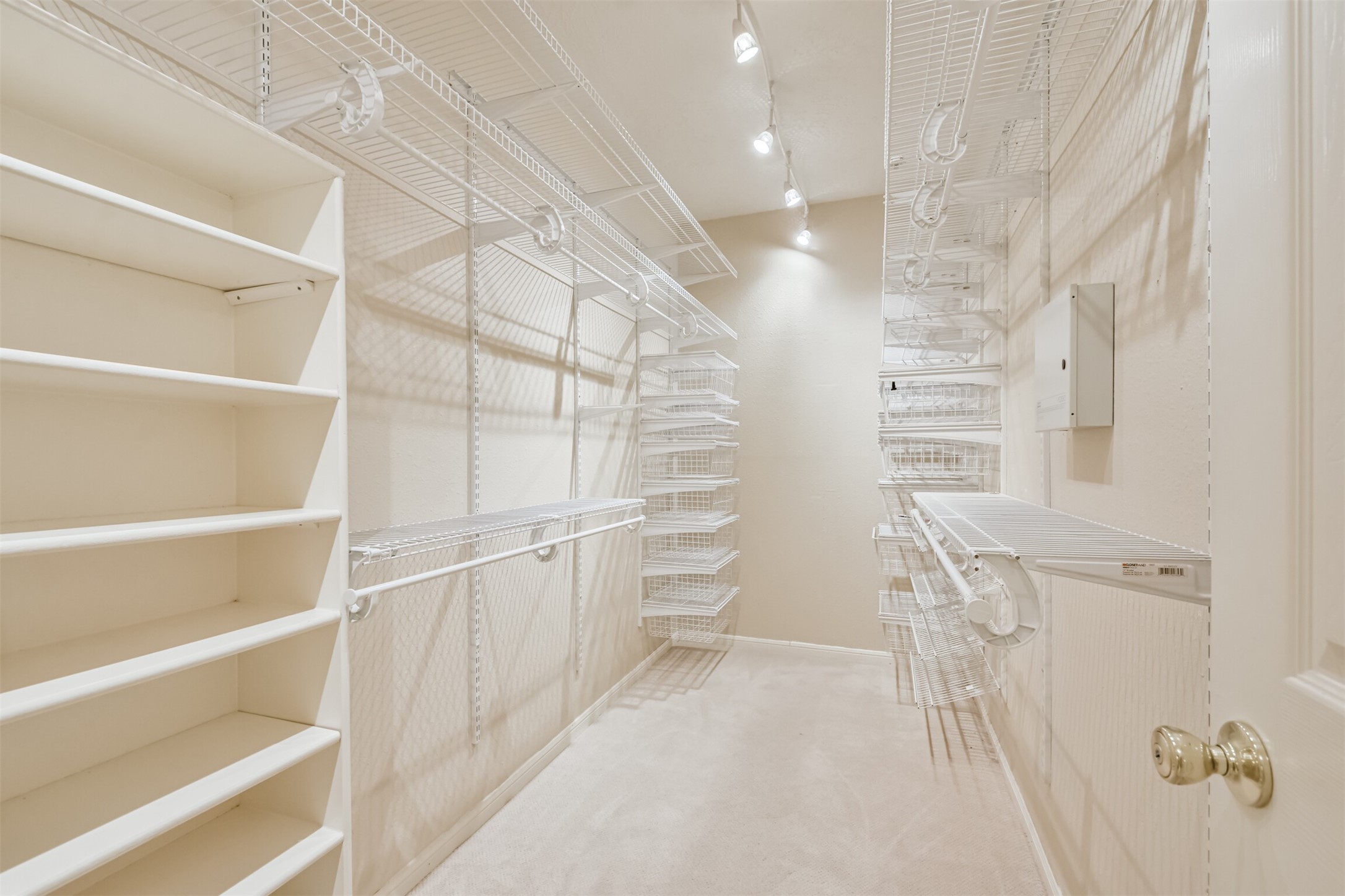 7603 Quintero Drive Houston, TX 77083 - Photo 29 of 36 a view of walk in closet with empty racks