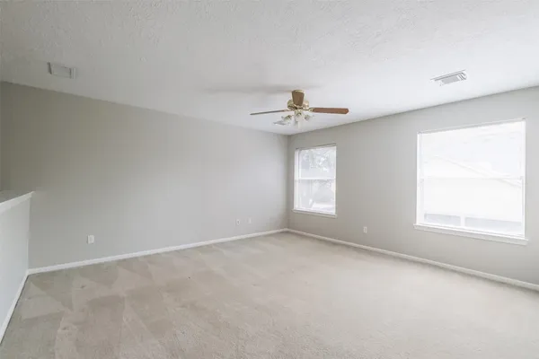 a view of a big room with carpet