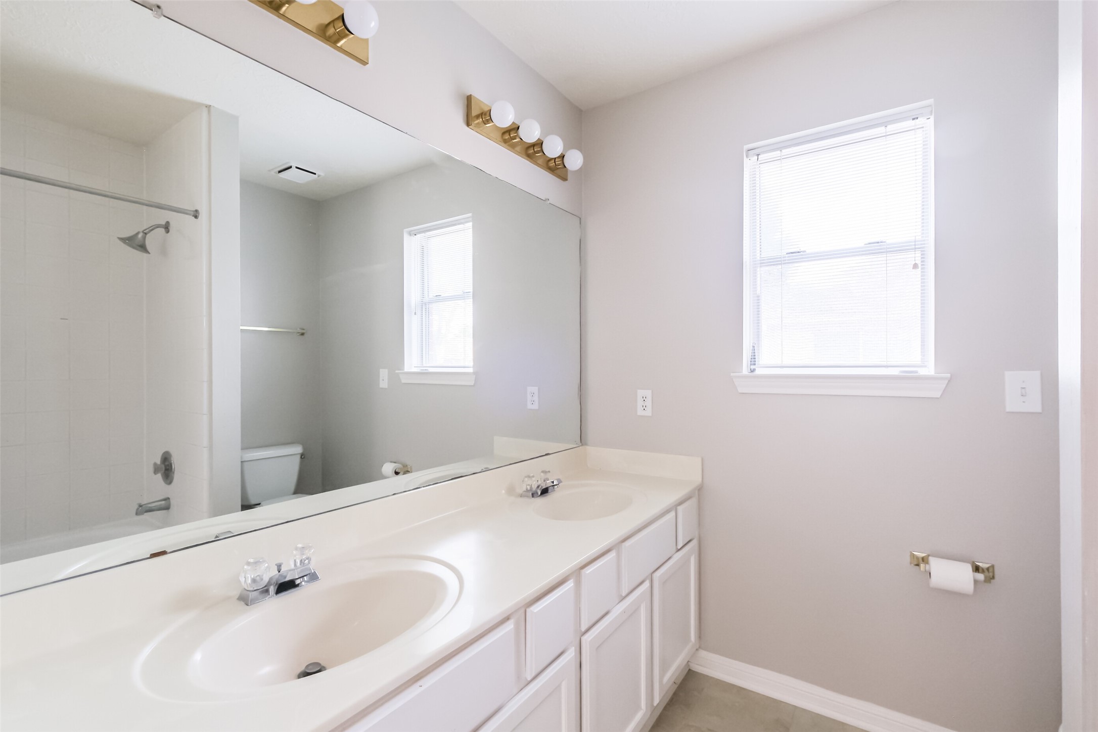 7603 Quintero Drive Houston, TX 77083 - Photo 34 of 36 a bathroom with a sink and a window