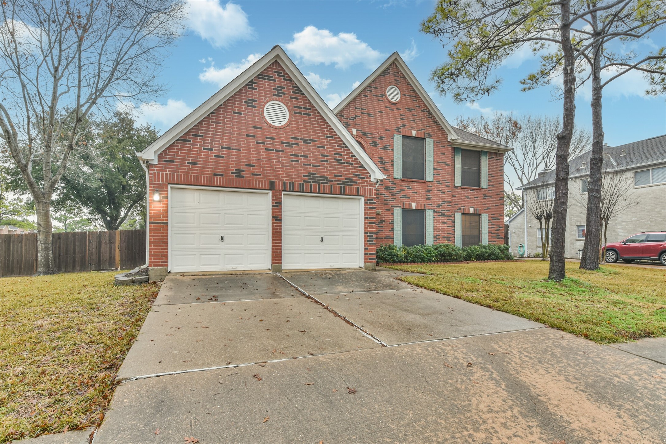 7603 Quintero Drive Houston, TX 77083 - Photo 4 of 36 a front view of a house with a yard and garage