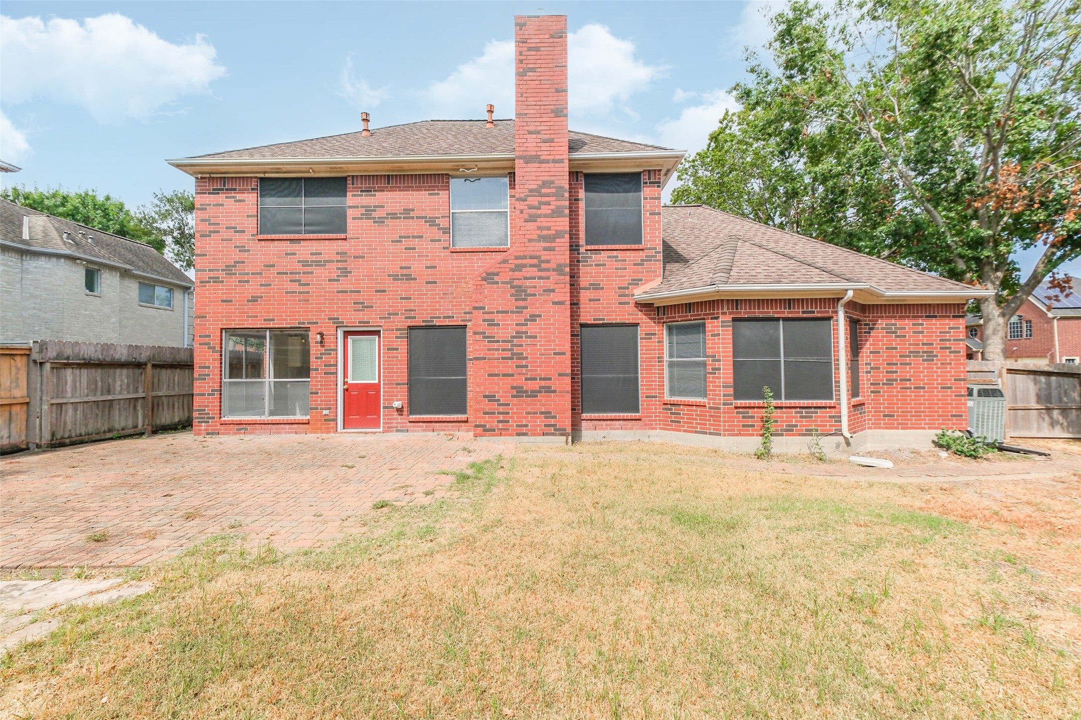 7603 Quintero Drive Houston, TX 77083 - Photo 7 of 36 a front view of a house with a yard and garage