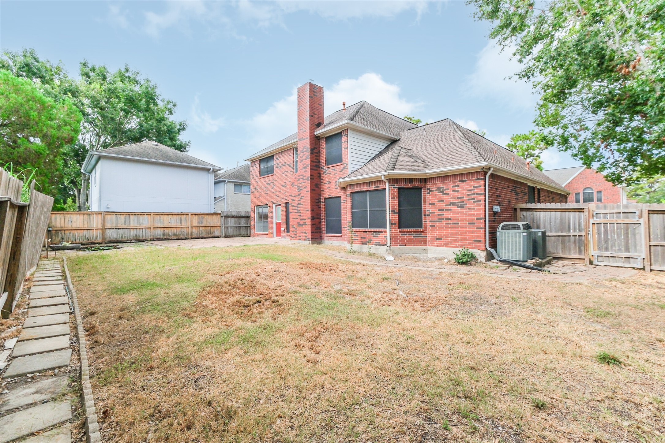 7603 Quintero Drive Houston, TX 77083 - Photo 9 of 36 a front view of a house with a yard