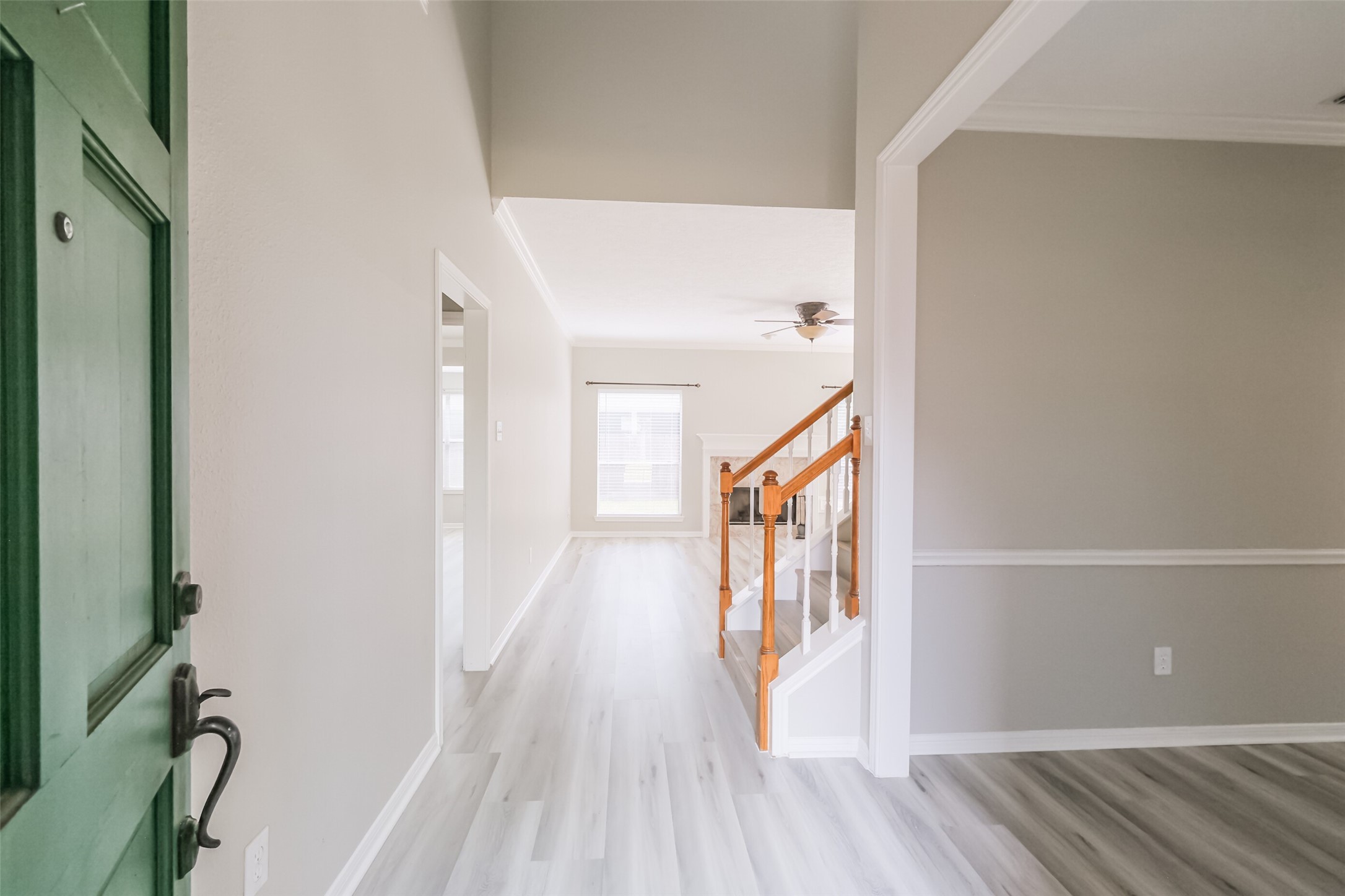 7603 Quintero Drive Houston, TX 77083 - Photo 10 of 36 a view of a hallway with wooden floor and staircase