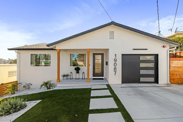 a front view of a house with a yard