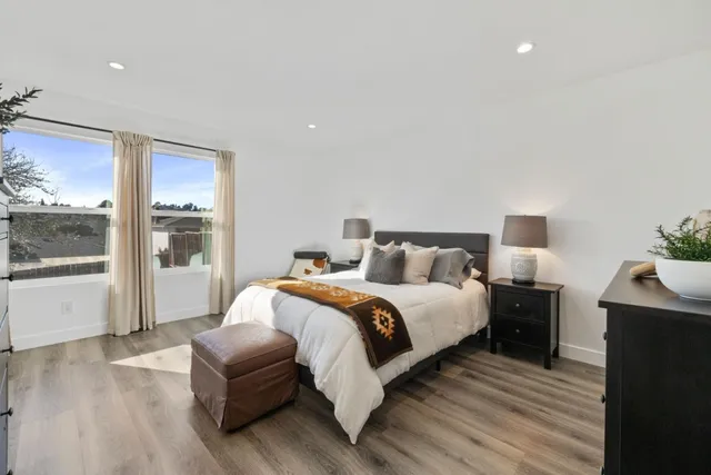 a bedroom with bed and window