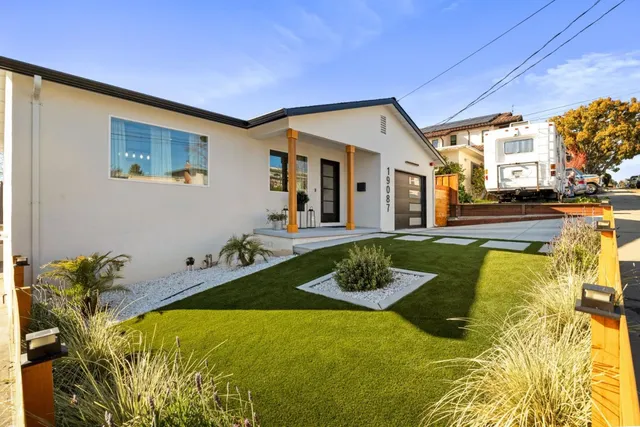 a view of a swimming pool with furniture