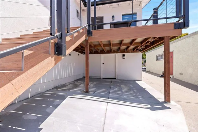 a view of a patio with table and chairs with wooden floor
