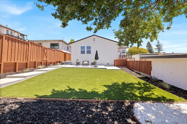 an aerial view of a house with a swimming pool