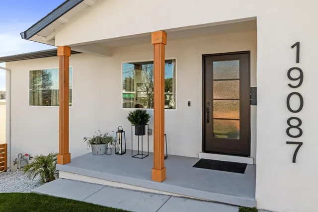 a front view of a house with garden