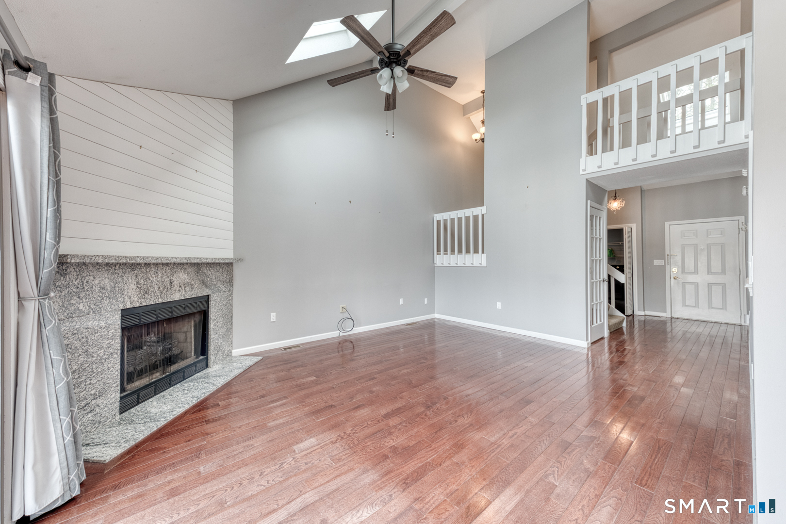 5 Vicki Lane, Unit 5 Colchester, CT 06415 - Photo 11 of 42 a view of a livingroom with a fireplace and wooden floor