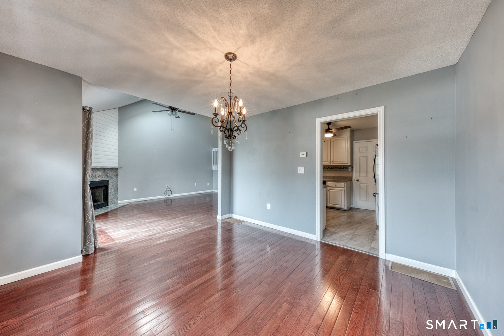 5 Vicki Lane, Unit 5 Colchester, CT 06415 - Photo 13 of 42 a view of a room with wooden floor staircase and a kitchen space
