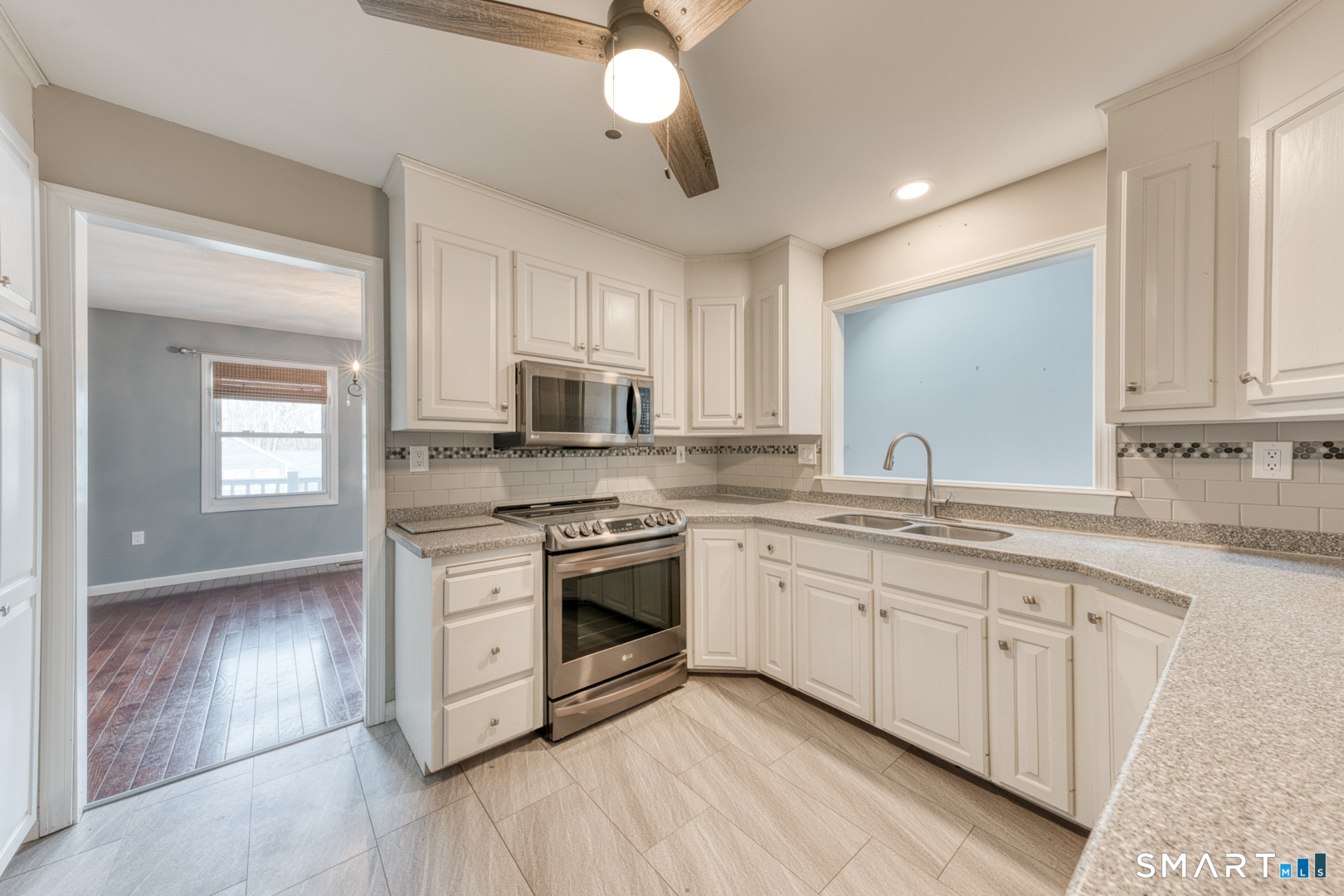 5 Vicki Lane, Unit 5 Colchester, CT 06415 - Photo 17 of 42 a kitchen with stainless steel appliances granite countertop a stove a sink and a microwave