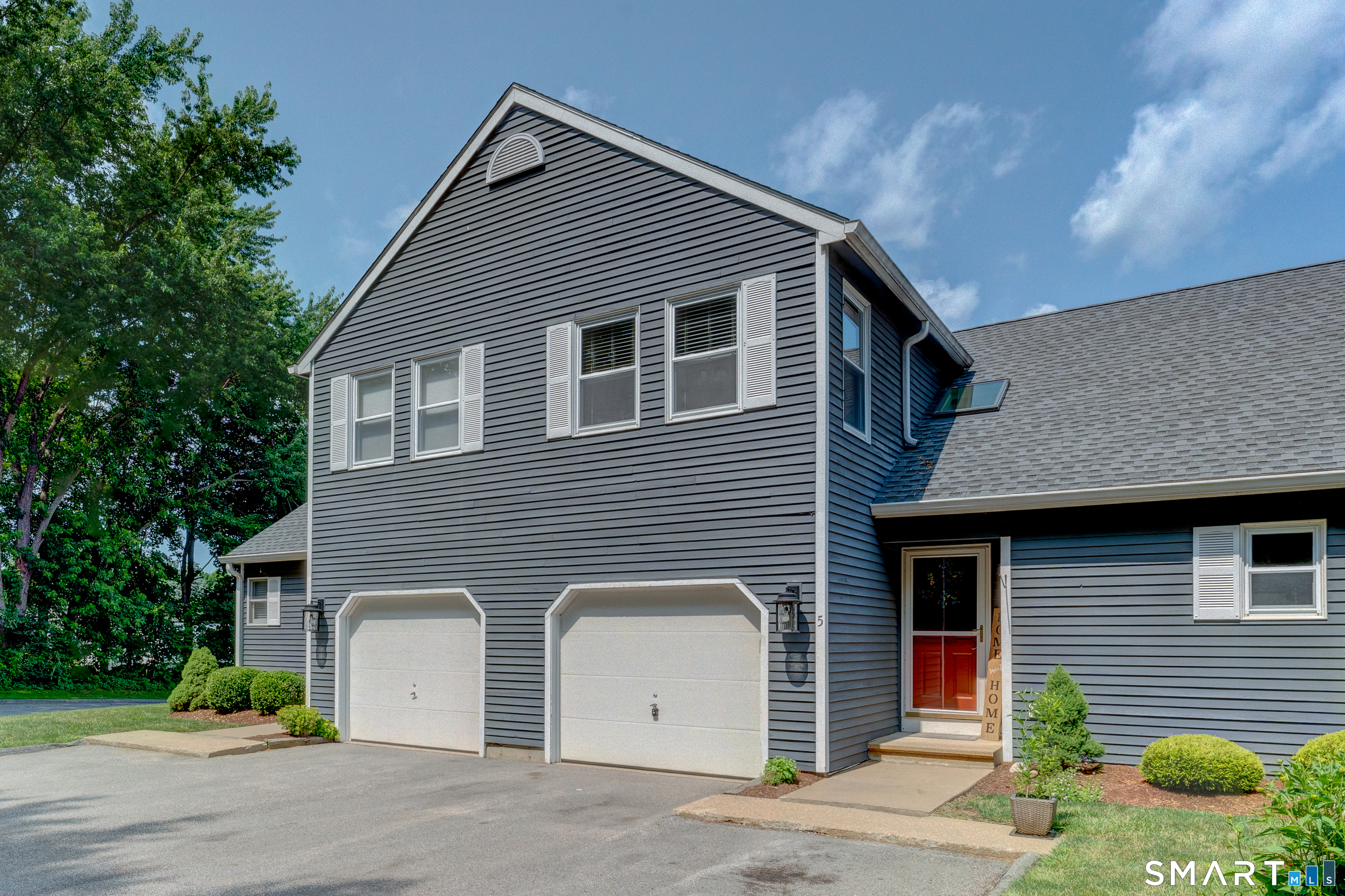 5 Vicki Lane, Unit 5 Colchester, CT 06415 - Photo 2 of 42 a view of a house with a yard and garage