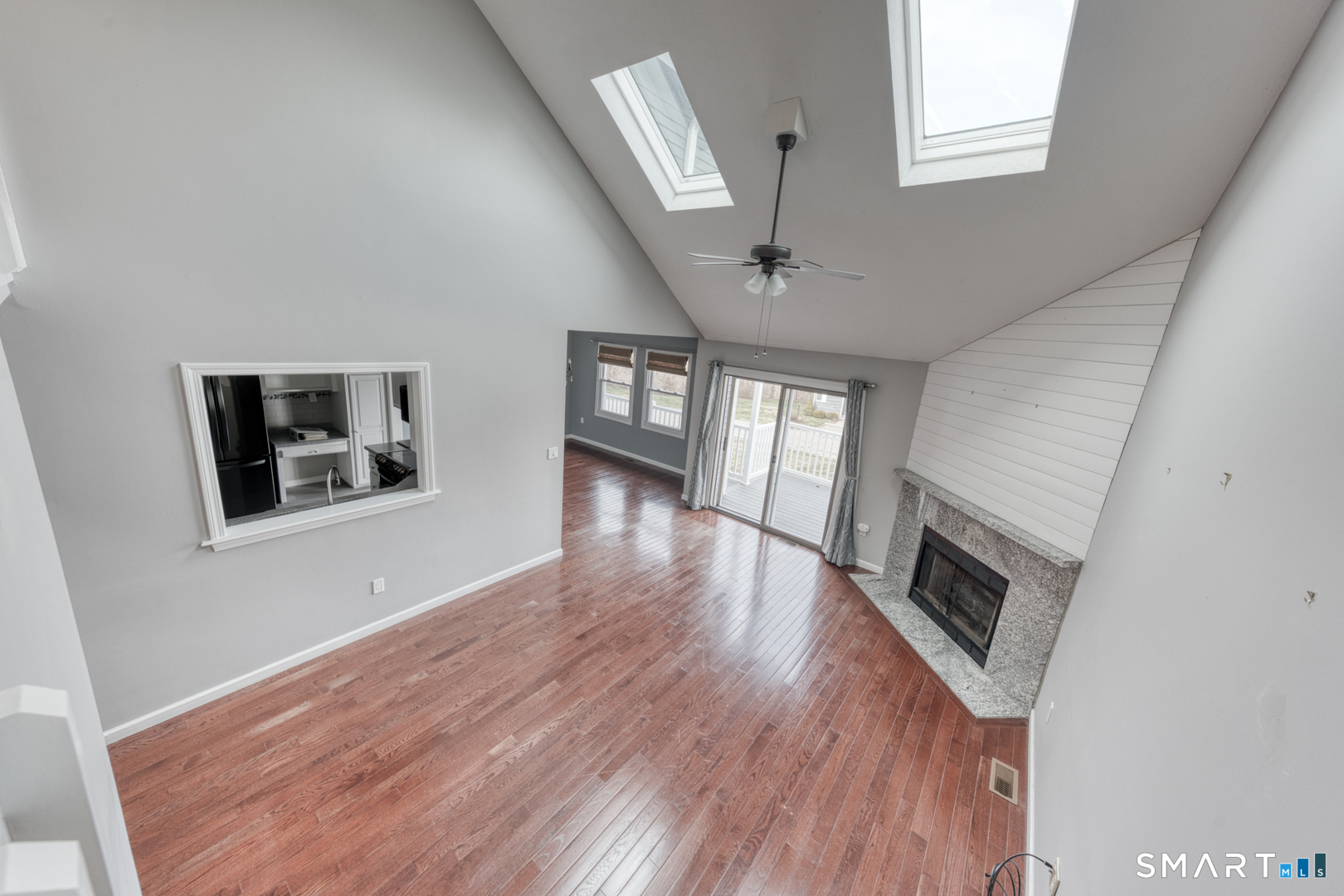 5 Vicki Lane, Unit 5 Colchester, CT 06415 - Photo 21 of 42 a view of a livingroom with wooden floor and a fireplace