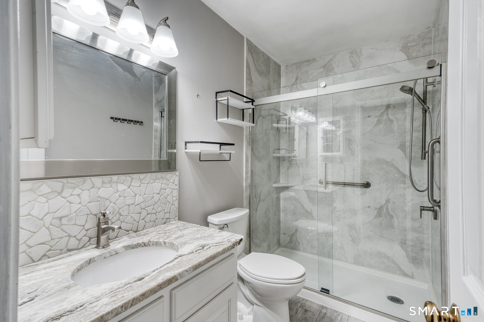 5 Vicki Lane, Unit 5 Colchester, CT 06415 - Photo 27 of 42 a bathroom with a sink toilet granite and shower