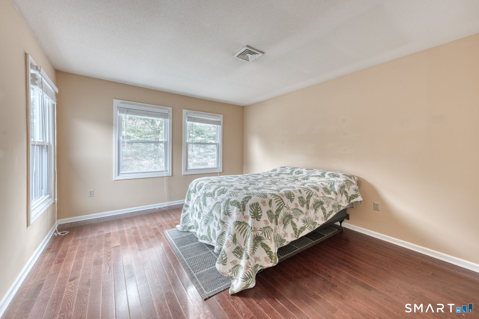 5 Vicki Lane, Unit 5 Colchester, CT 06415 - Photo 28 of 42 a bed sitting in a bedroom next to a window
