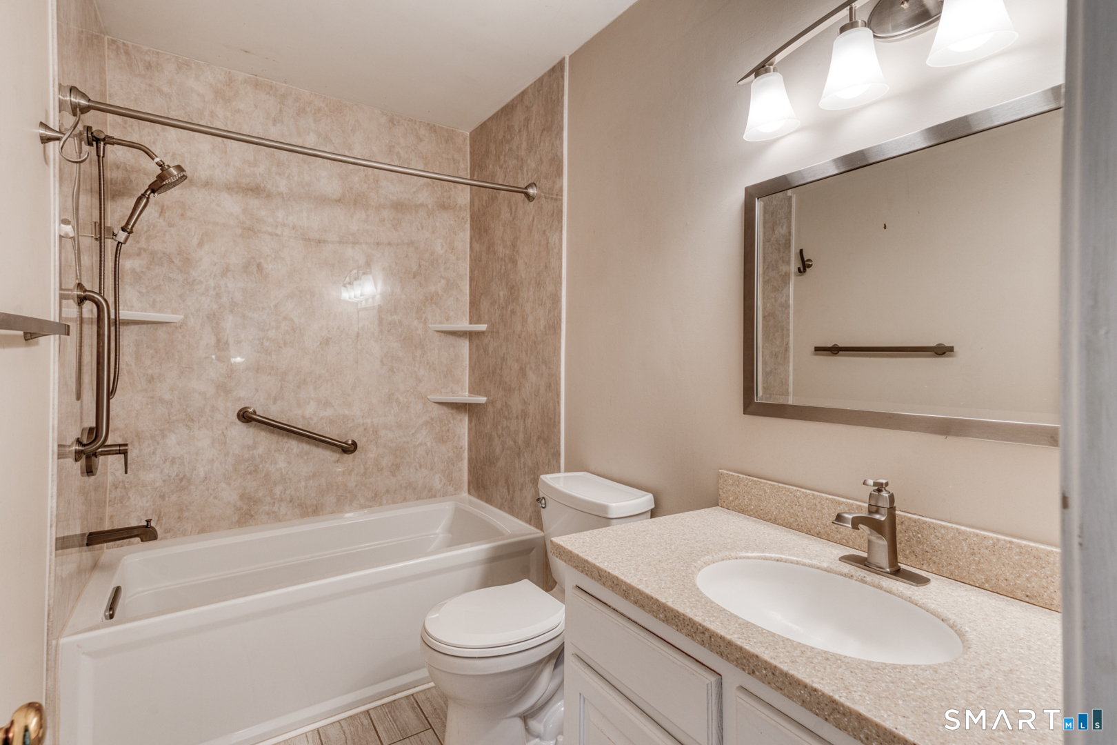 5 Vicki Lane, Unit 5 Colchester, CT 06415 - Photo 30 of 42 a bathroom with a granite countertop sink toilet and shower