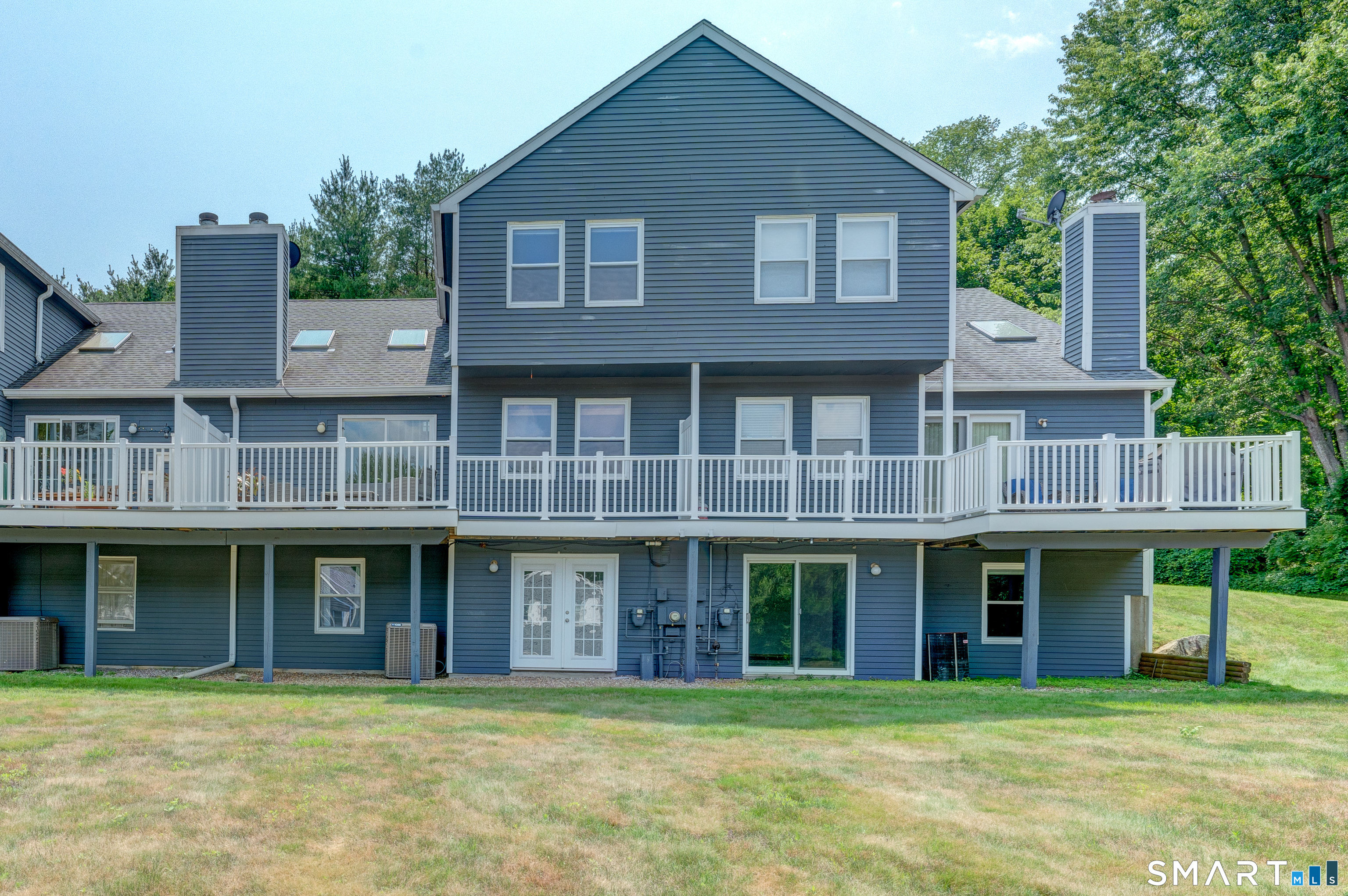 5 Vicki Lane, Unit 5 Colchester, CT 06415 - Photo 3 of 42 a front view of a building with a garden