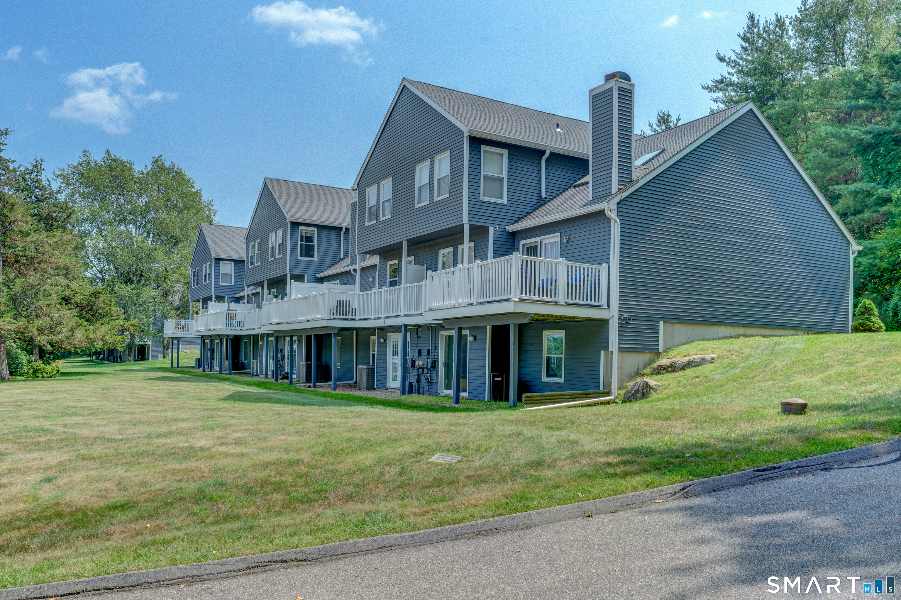 5 Vicki Lane, Unit 5 Colchester, CT 06415 - Photo 4 of 42 a front view of a house with garden