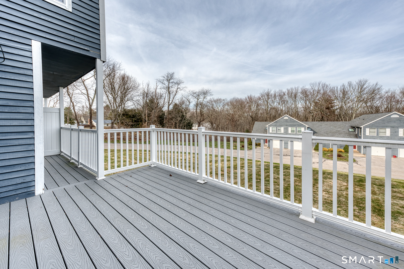 5 Vicki Lane, Unit 5 Colchester, CT 06415 - Photo 7 of 42 a view of deck with wooden floor and fence