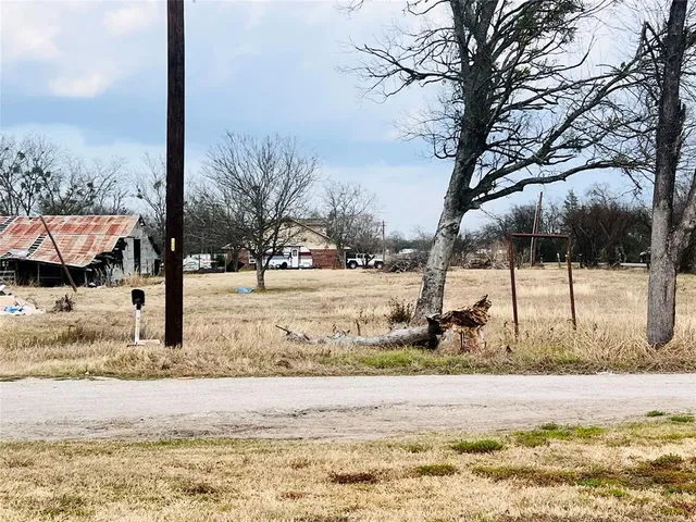 a view of a yard covered in snow