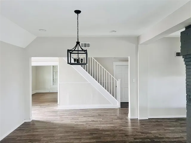 a view of a hallway with a white house