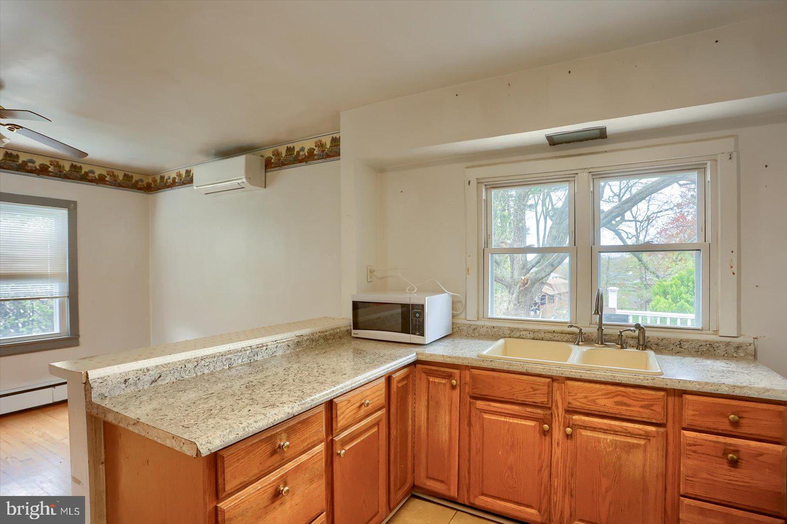 2301 Snow Road Edgewood, MD 21040 - Photo 14 of 41 a kitchen with granite countertop a sink and a window