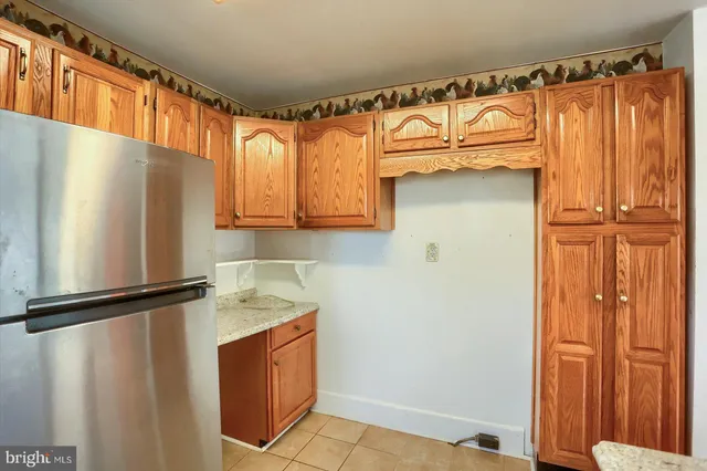 a bathroom with granite countertop window and a sink