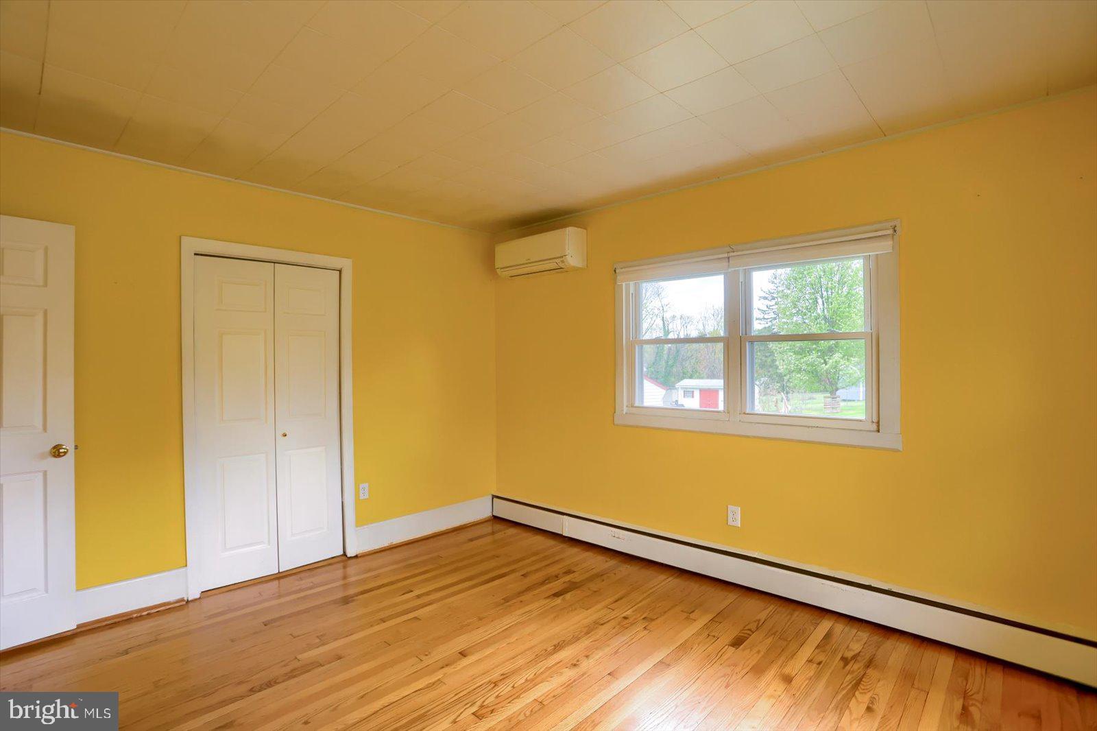 2301 Snow Road Edgewood, MD 21040 - Photo 18 of 41 a view of an empty room with wooden floor and a window