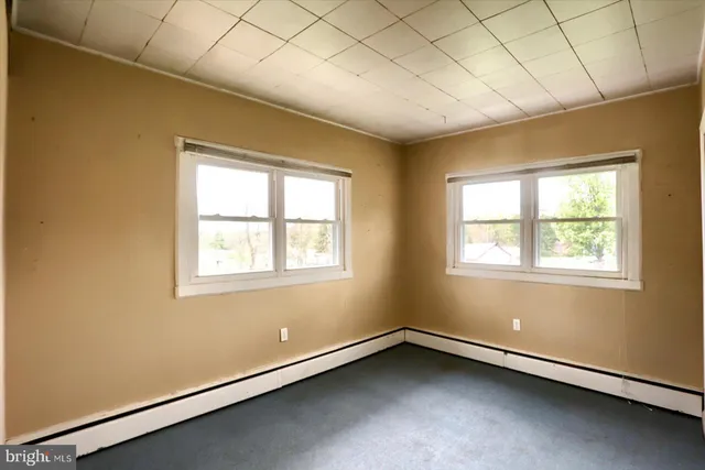 an empty room with windows