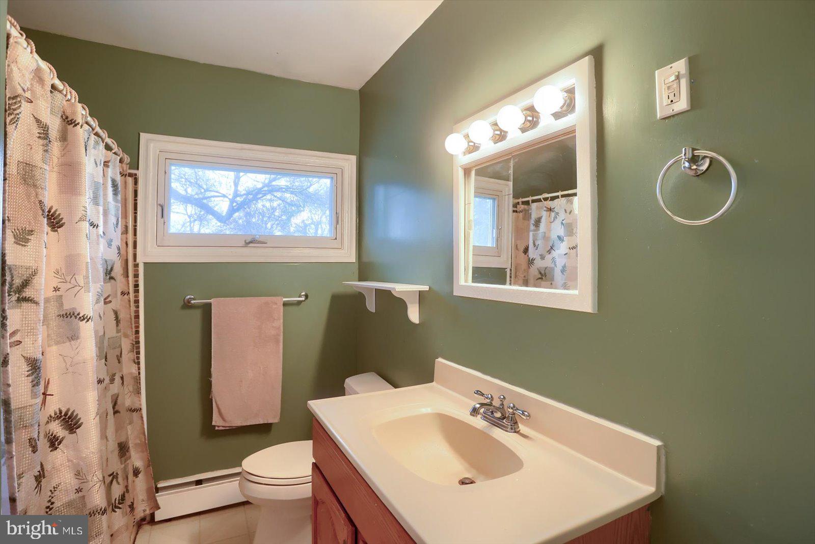 2301 Snow Road Edgewood, MD 21040 - Photo 22 of 41 a bathroom with a sink mirror and toilet
