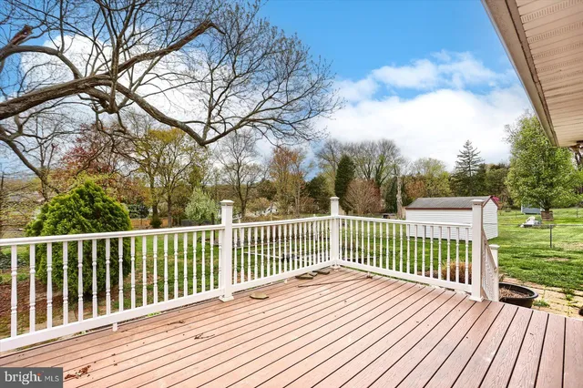 a view of a bench in a backyard