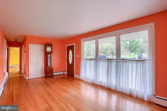 a view of front door with wooden floor