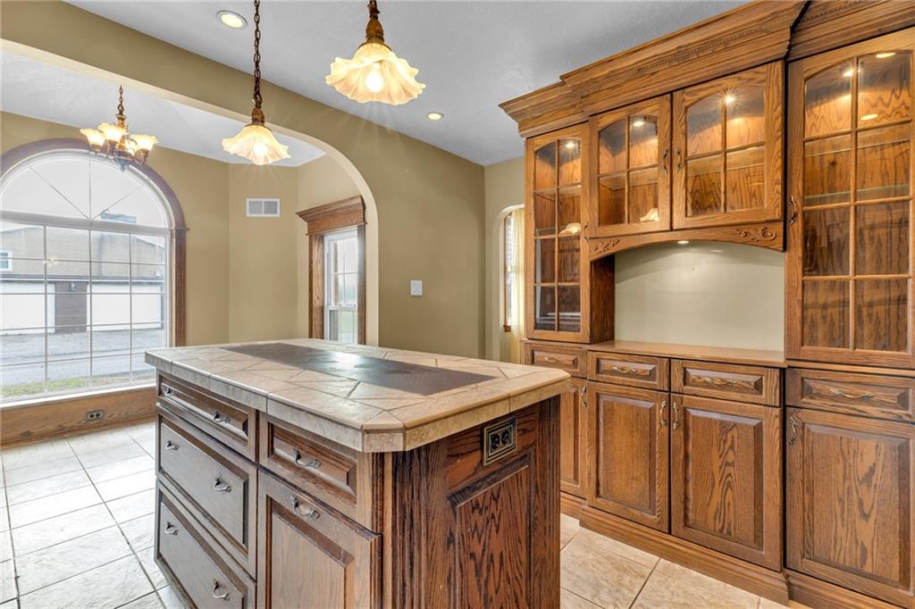 1601 Cottage Avenue Conway, PA 15027 - Photo 11 of 41 a kitchen with a sink a counter space and a chandelier