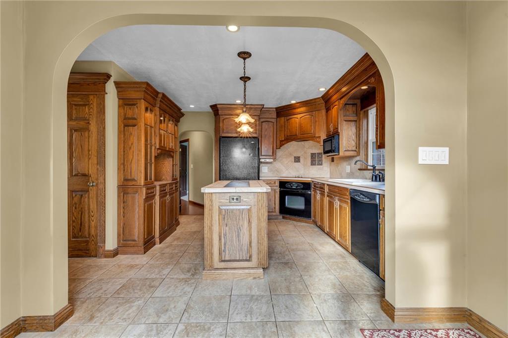 1601 Cottage Avenue Conway, PA 15027 - Photo 13 of 41 a open kitchen with a sink a refrigerator and a stove