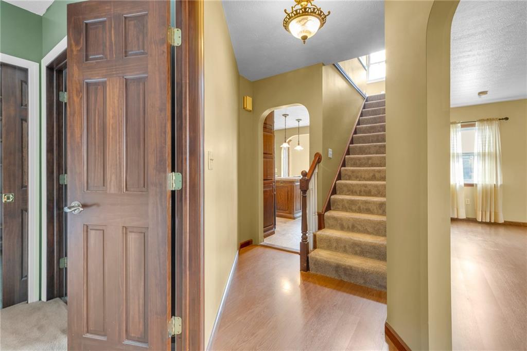 1601 Cottage Avenue Conway, PA 15027 - Photo 26 of 41 a view of a hallway with wooden floor and staircase