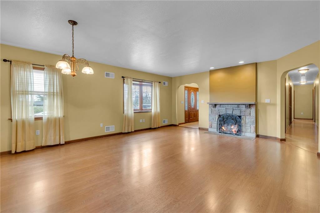 1601 Cottage Avenue Conway, PA 15027 - Photo 5 of 41 a view of empty room with wooden floor and fireplace