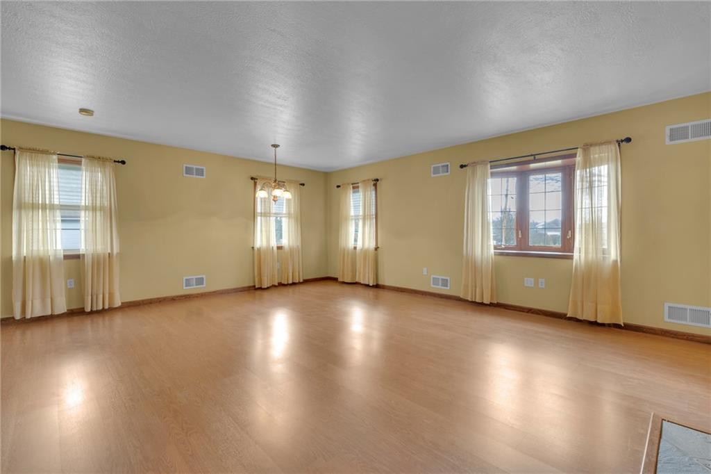1601 Cottage Avenue Conway, PA 15027 - Photo 7 of 41 an empty room with wooden floor and windows