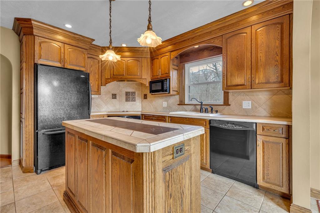 1601 Cottage Avenue Conway, PA 15027 - Photo 10 of 41 a kitchen with stainless steel appliances granite countertop a sink and a refrigerator