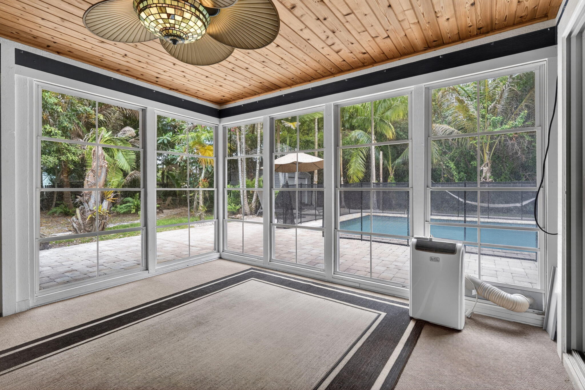17391 Alexander Run Jupiter, FL 33478 - Photo 29 of 55 Closed patio with vinyl windows