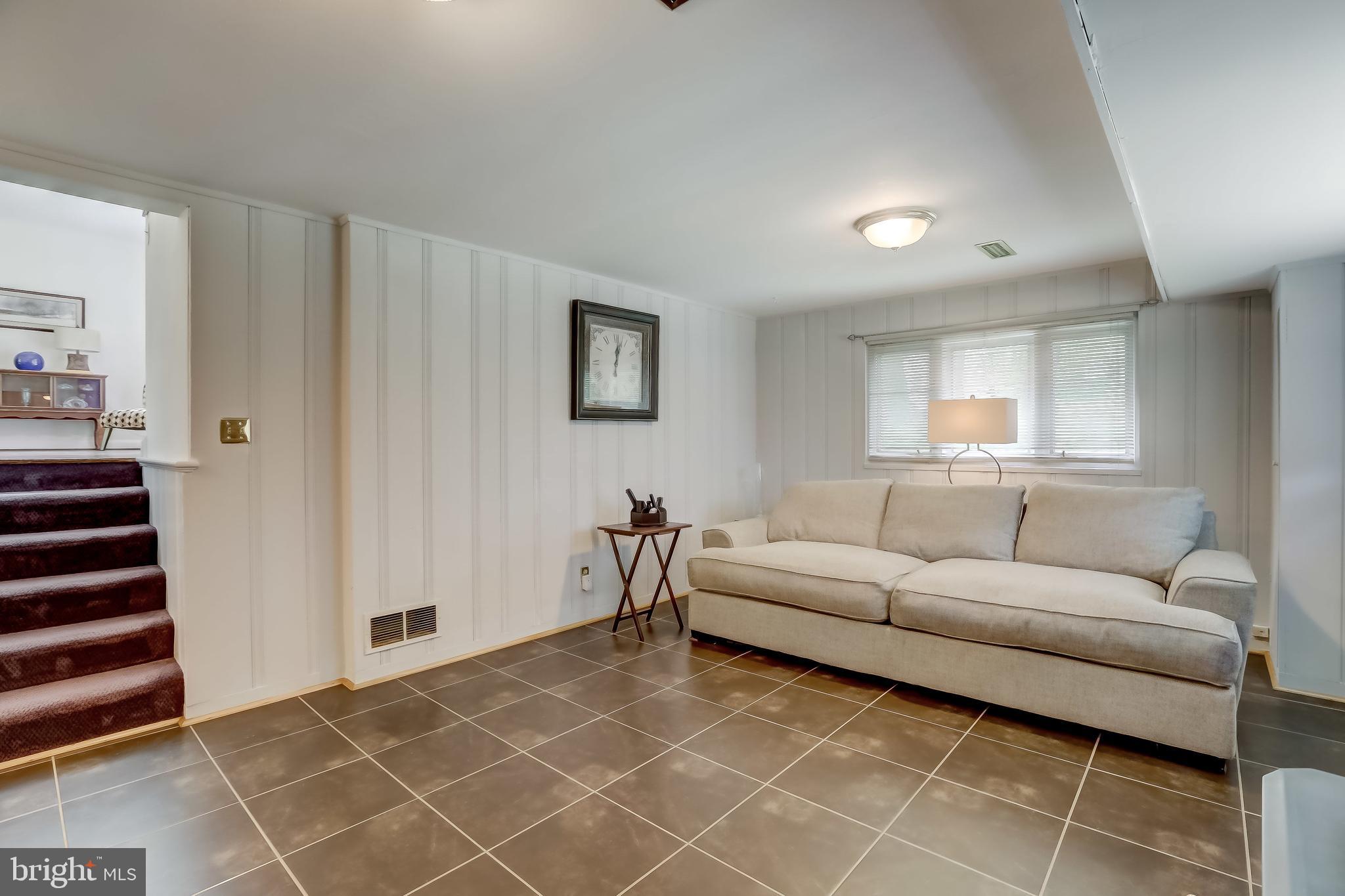506 Upland Road Baltimore, MD 21208 - Photo 13 of 35 Spacious living area with ceramic tile