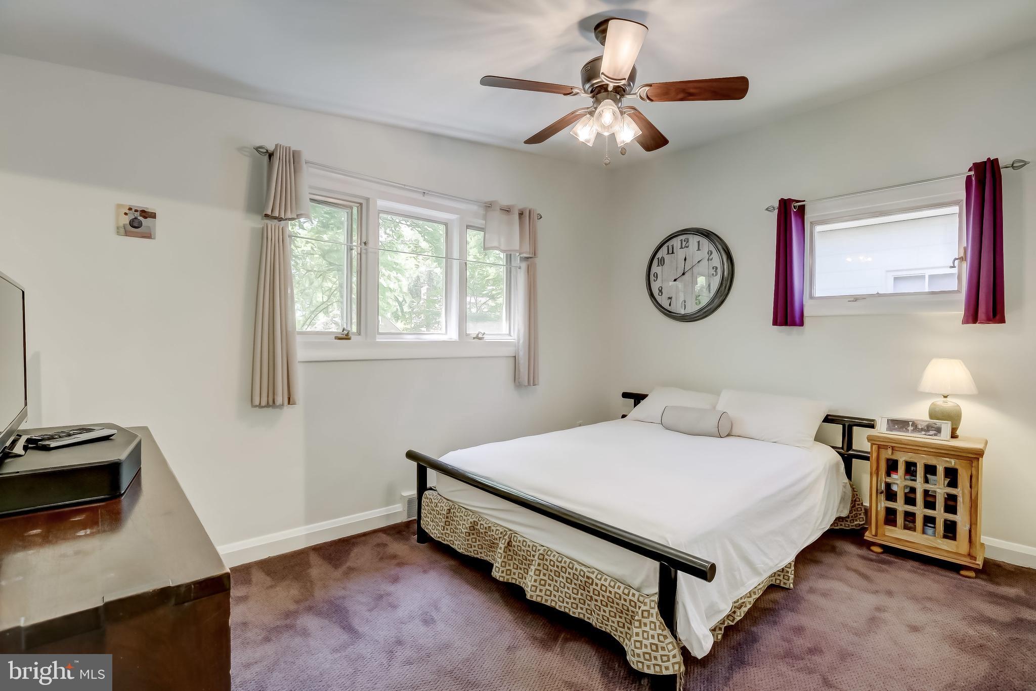506 Upland Road Baltimore, MD 21208 - Photo 18 of 35 Bedroom with ceiling fan (carpet over hardwood)