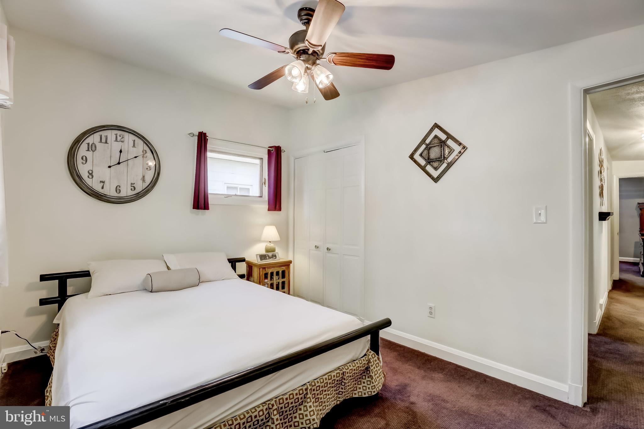 506 Upland Road Baltimore, MD 21208 - Photo 19 of 35 Bedroom with ceiling fan (carpet over hardwood)