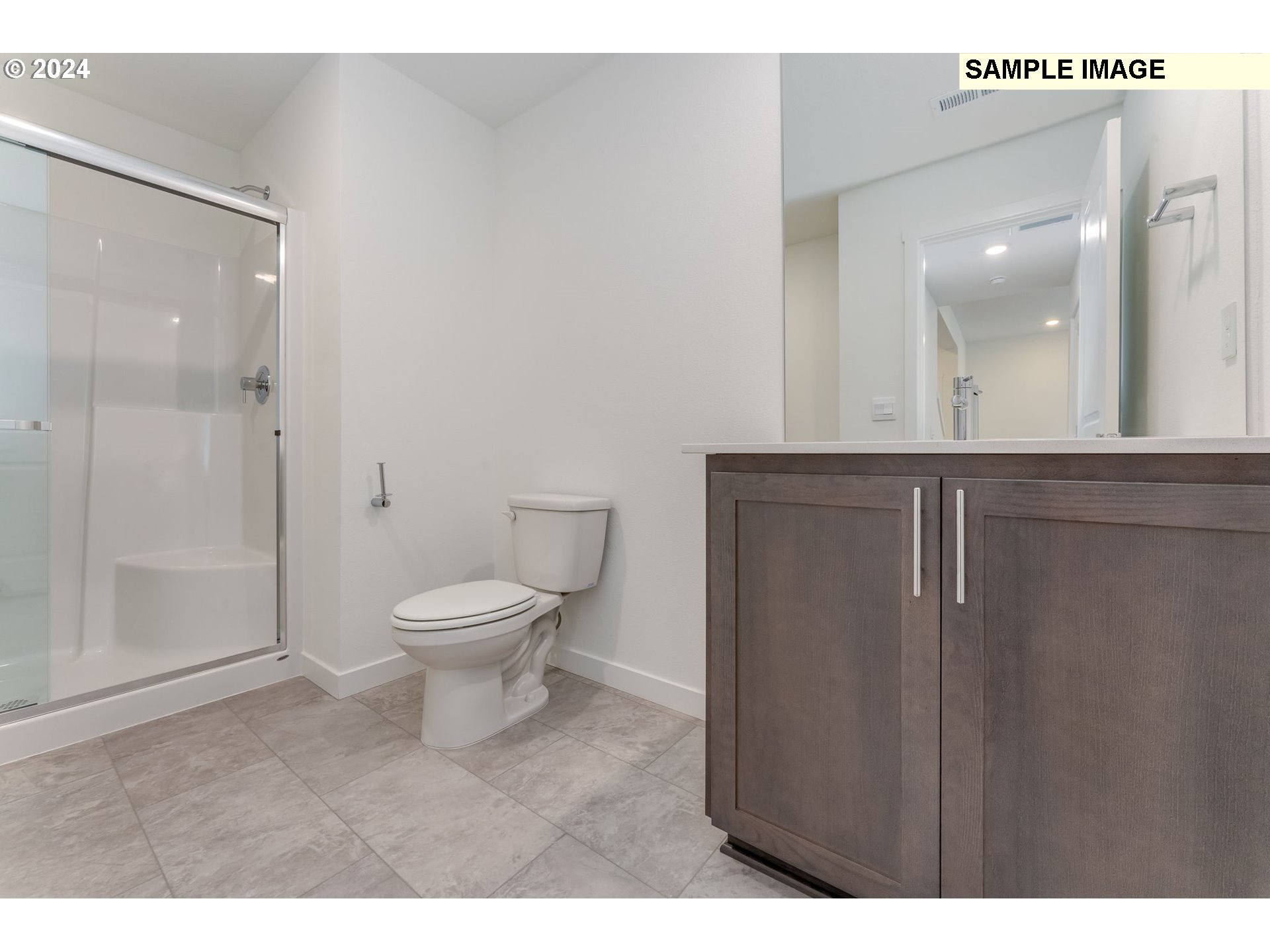 1120 West 15th Street La Center, WA 98629 - Photo 19 of 38 a bathroom with a toilet a sink and shower