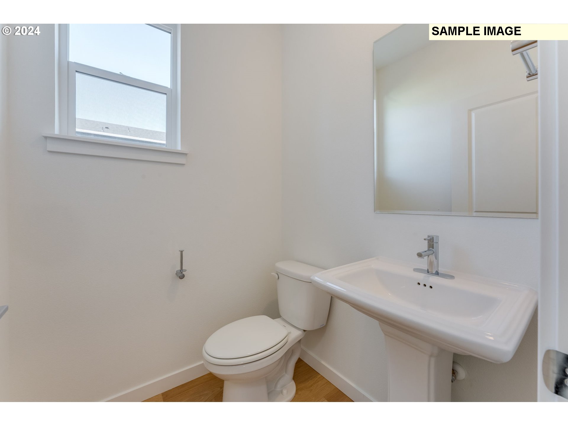 1120 West 15th Street La Center, WA 98629 - Photo 3 of 38 a bathroom with a sink a toilet and mirror