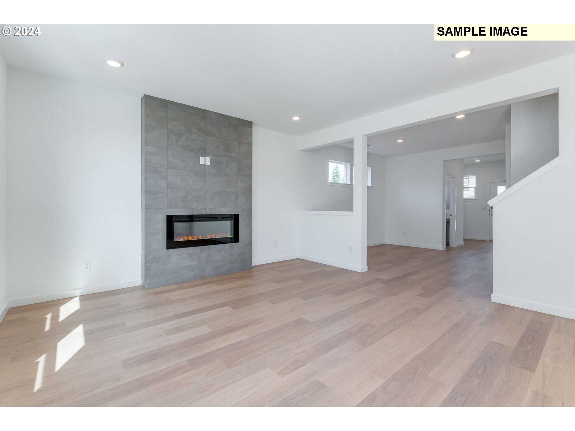 1120 West 15th Street La Center, WA 98629 - Photo 7 of 38 a view of empty room with wooden floor and kitchen