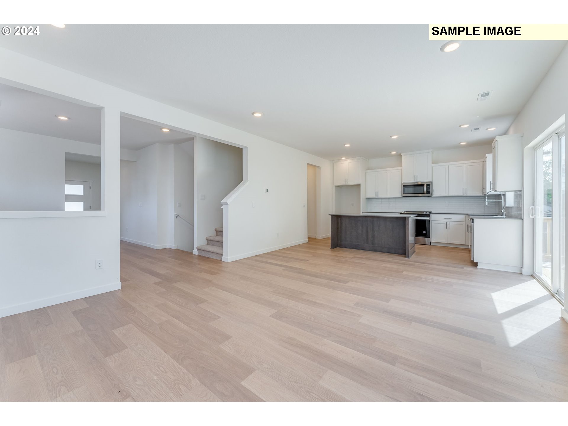 1120 West 15th Street La Center, WA 98629 - Photo 8 of 38 a view of kitchen and kitchen with furniture wooden floor