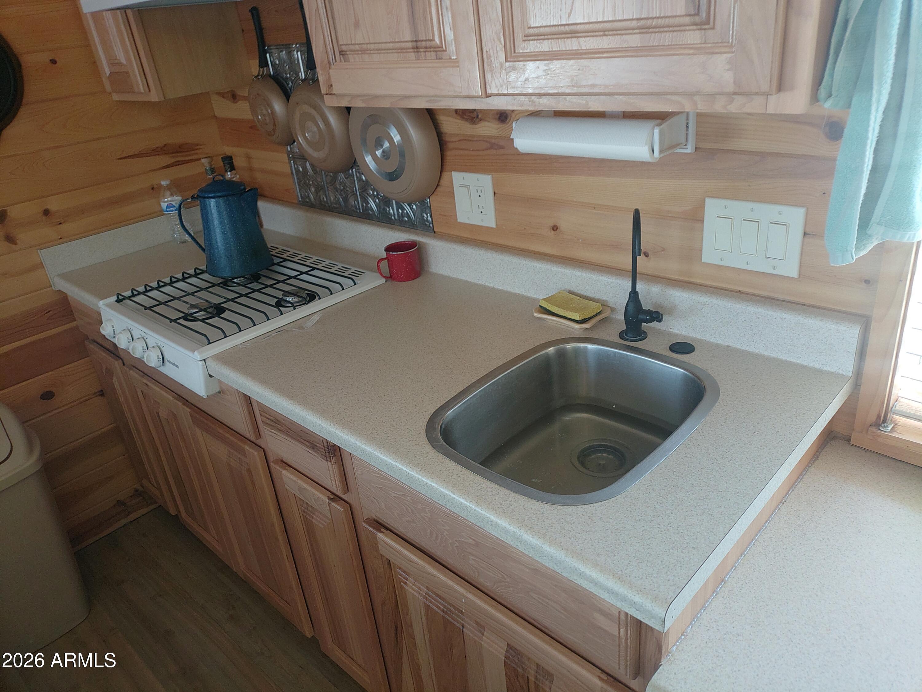 1417 Buffington Hill Road Heber, AZ 85928 - Photo 10 of 17 a kitchen with a stove and a sink