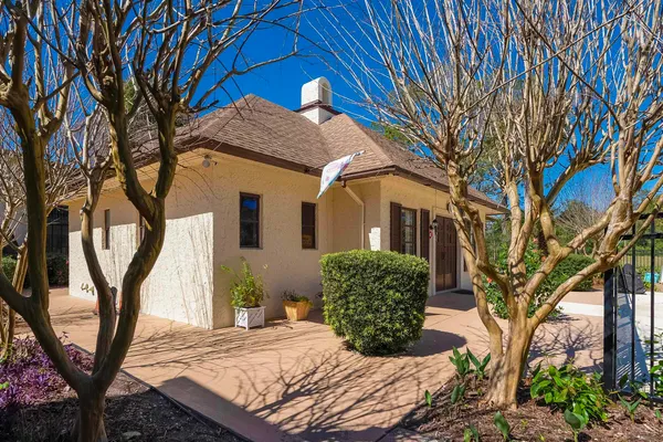 a view of a house with a tree